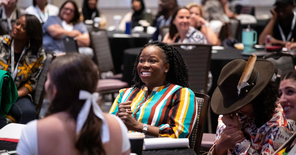 Dr. Aqueelah Roberson smiles at an event.