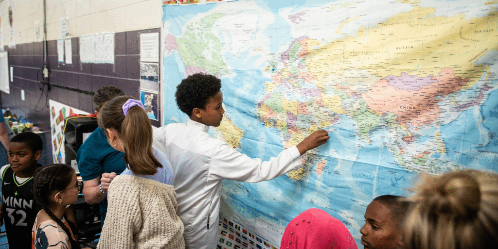 Students using a map for an interactive project.