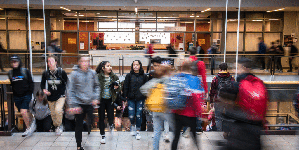 Students navigating a busy high school.