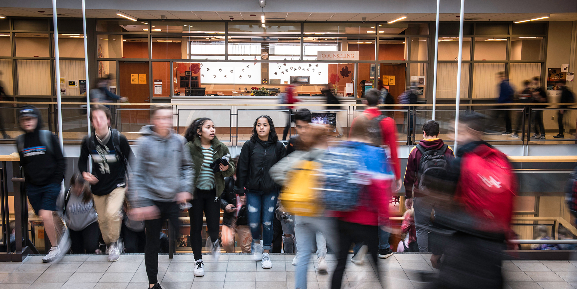Students navigating a busy high school.
