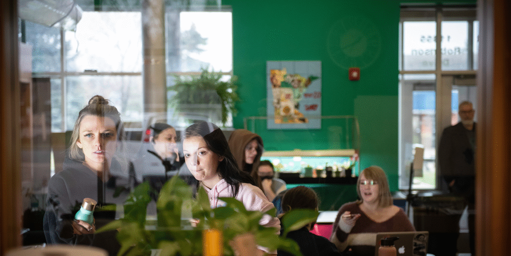 Students in a classroom studying plant life.