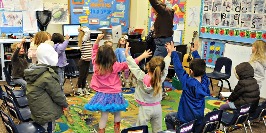 Children playing in a classroom